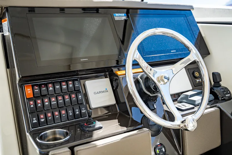 Miss Morgan III Yacht Photos Pics 2021 Pursuit 365DC boat dashboard with Garmin navigation and steering wheel.