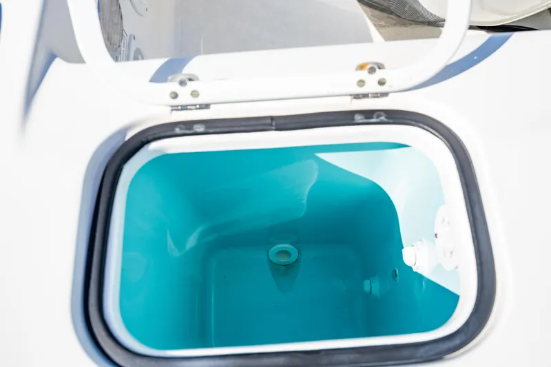 Miss Morgan III Yacht Photos Pics Open storage compartment on 2021 Pursuit 365DC boat, featuring a clean, blue interior.