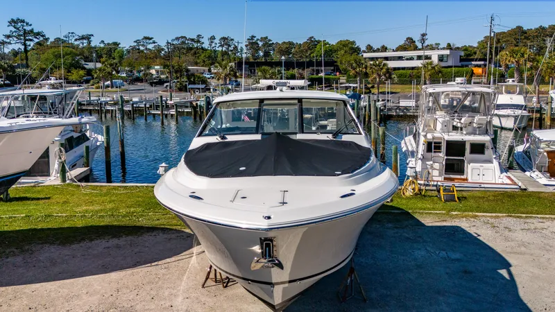 Miss Morgan III Yacht Photos Pics 2021 Pursuit 365DC boat docked at a marina, surrounded by other vessels.