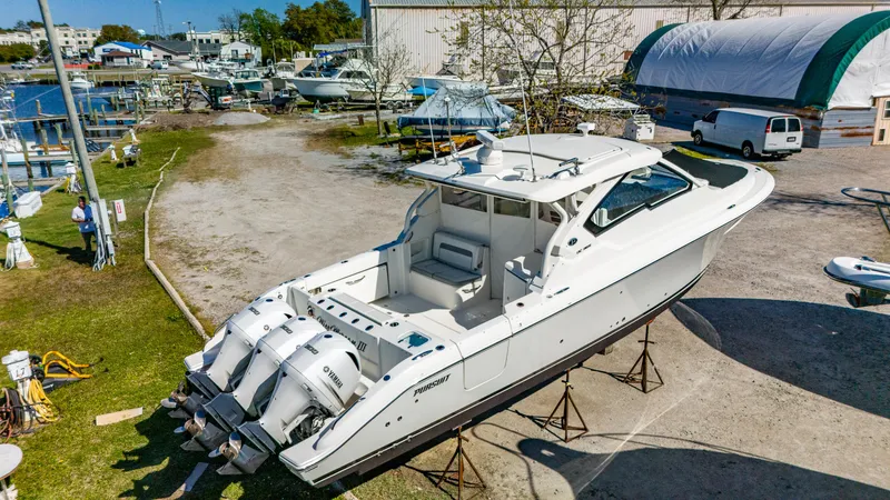 Miss Morgan III Yacht Photos Pics 2021 Pursuit 365DC boat on stands in a marina setting.