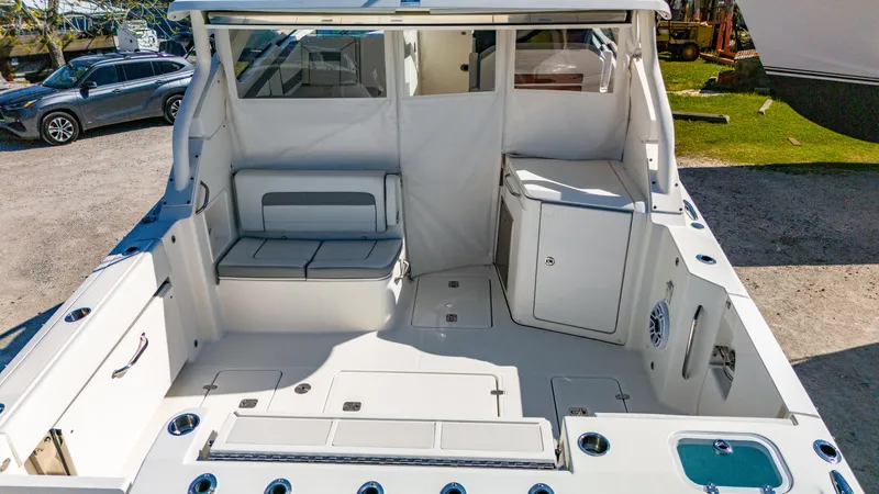 Miss Morgan III Yacht Photos Pics 2021 Pursuit 365DC boat interior with seating and storage compartments.