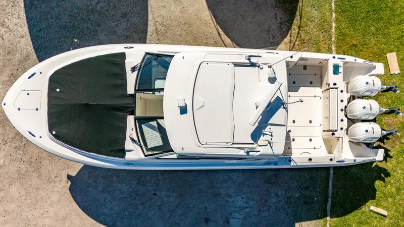 Miss Morgan III Yacht Photos Pics Overhead view of a 2021 Pursuit 365DC boat with triple outboard engines.