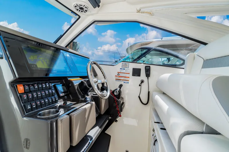 Miss Morgan III Yacht Photos Pics 2021 Pursuit 365DC boat interior with modern dashboard and steering wheel.