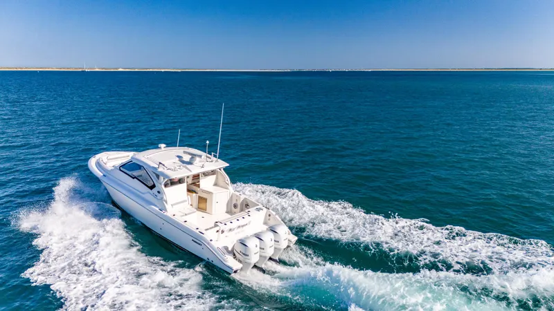 Miss Morgan III Yacht Photos Pics 2021 Pursuit 365DC boat cruising on open blue water.