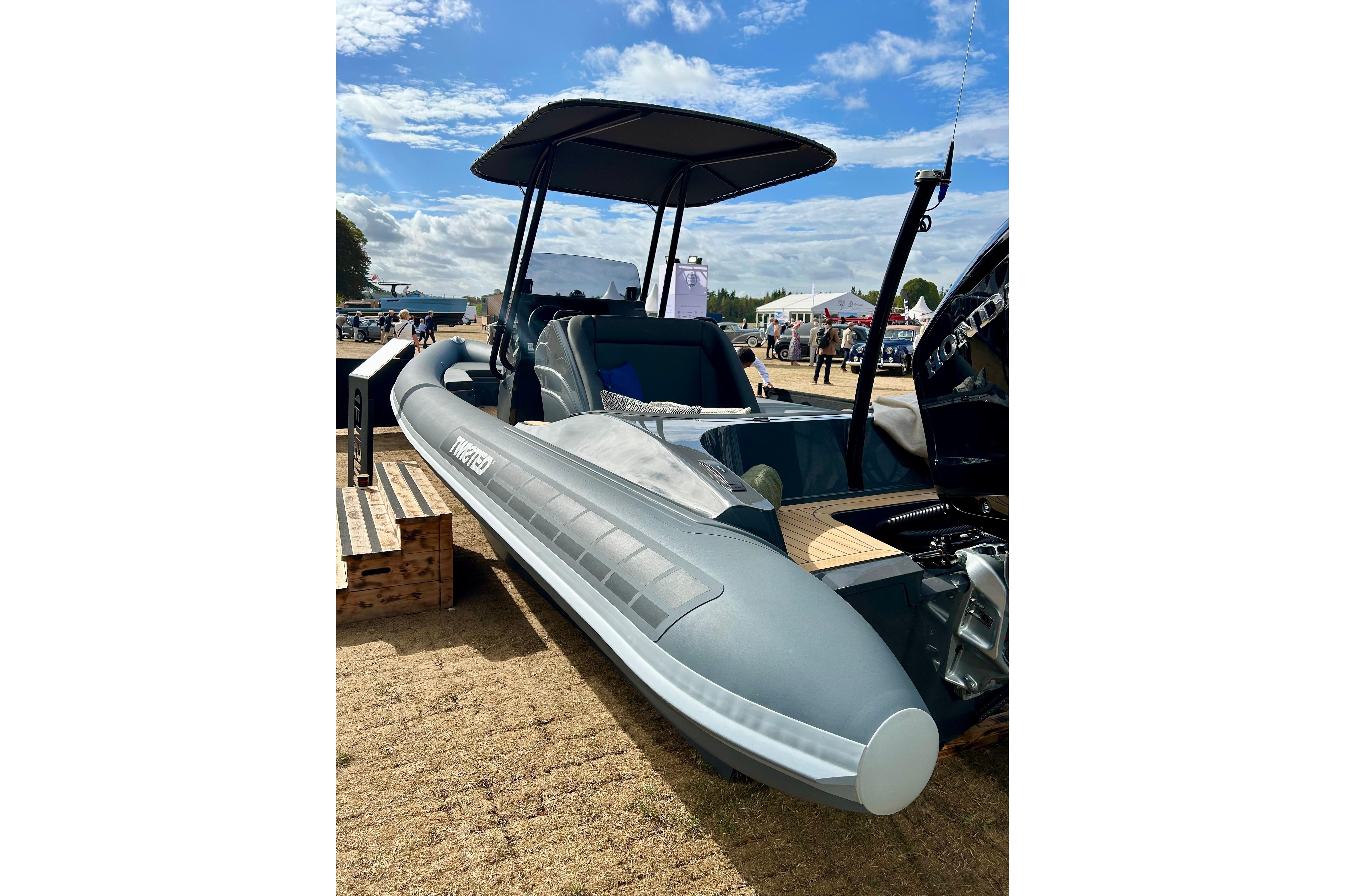2025 Twisted 28 Sport boat displayed outdoors under a blue sky.
