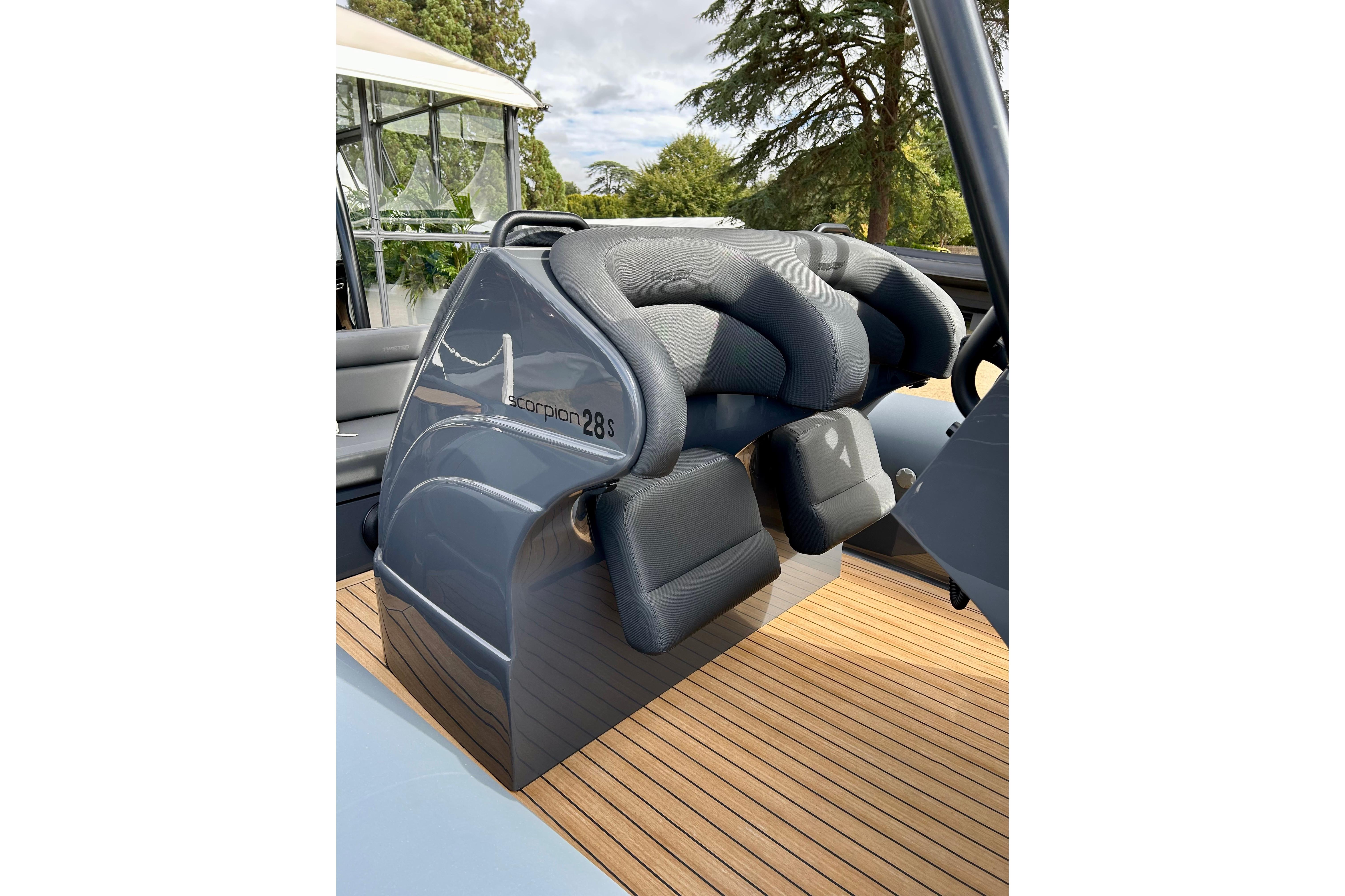 2025 Twisted 28 Sport boat interior with sleek seating and wooden deck.