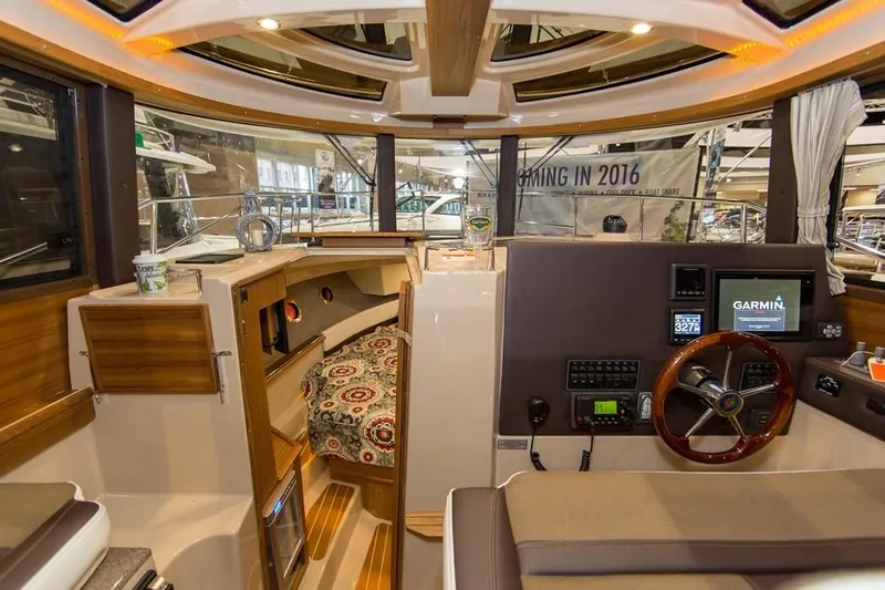 Poseidon&rsquo;s Lanai Yacht Photos Pics Manufacturer Provided Image: 2021 Ranger Tugs R-29 CB interior with helm, seating, and navigation equipment.