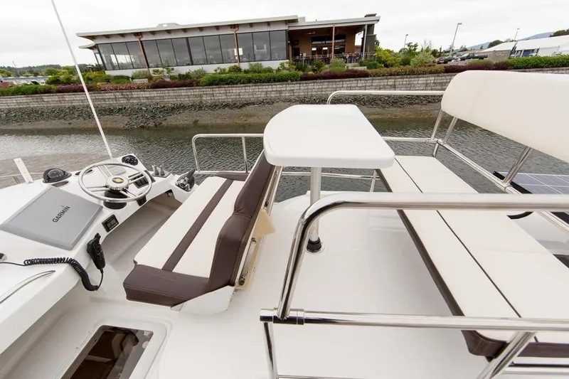 Poseidon&rsquo;s Lanai Yacht Photos Pics Manufacturer Provided Image: 2021 Ranger Tugs R-29 CB boat deck with seating and table.