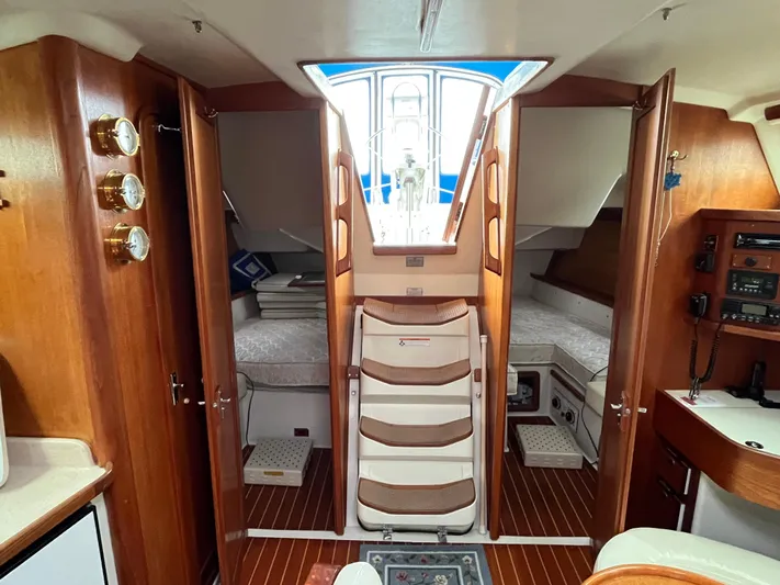Moonshadow Yacht Photos Pics Interior of 1998 Catalina 42 MkII sailboat with wooden finish and cozy cabin layout.