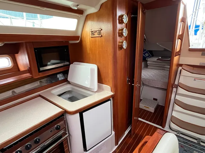 Moonshadow Yacht Photos Pics Interior of 1998 Catalina 42 MkII sailboat with kitchen and cozy cabin.