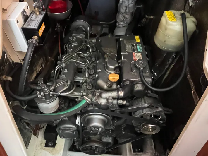 Moonshadow Yacht Photos Pics Engine compartment of a 1998 Catalina 42 MkII sailboat, showcasing mechanical components.