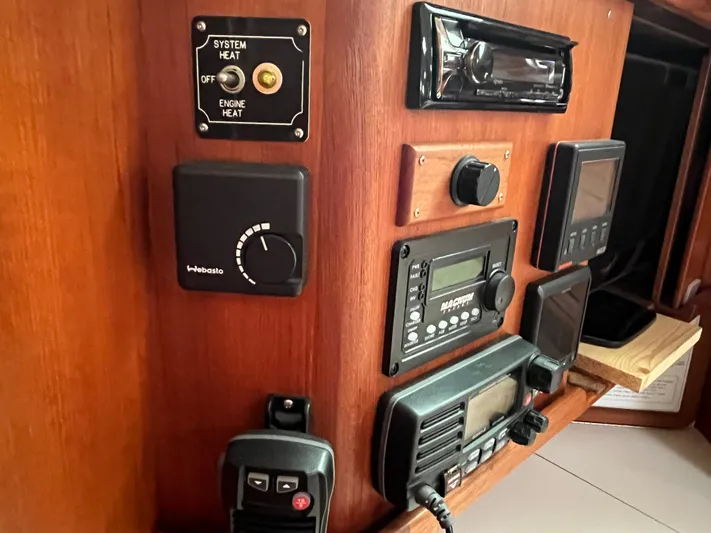 Moonshadow Yacht Photos Pics Control panel of a 1998 Catalina 42 MkII sailboat with various navigation and communication devices.