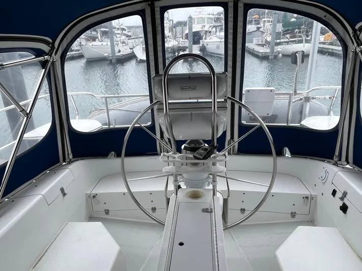 Moonshadow Yacht Photos Pics Cockpit of 1998 Catalina 42 MkII sailboat with marina view in background.