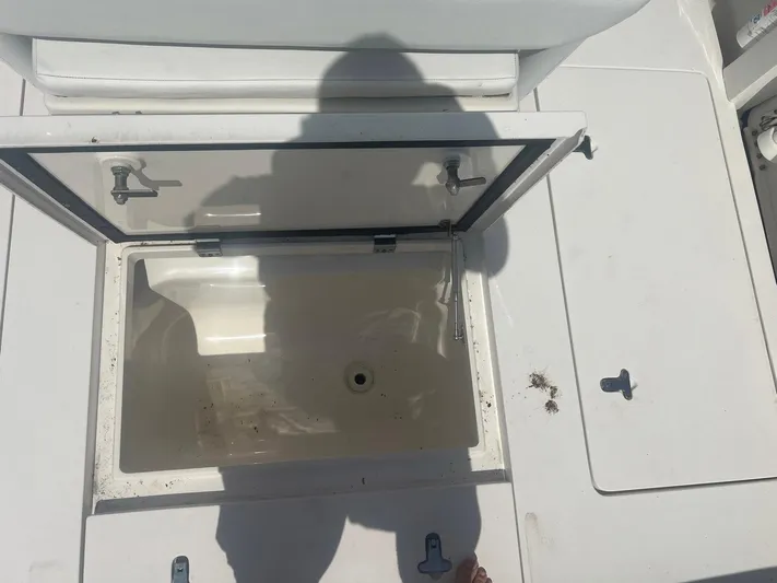  Yacht Photos Pics Open storage compartment on 2017 Intrepid 327 Cuddy boat deck.