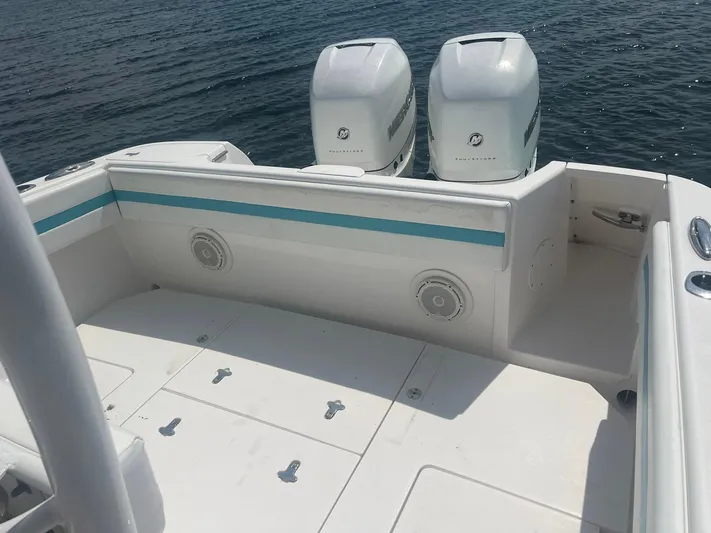  Yacht Photos Pics 2017 Intrepid 327 Cuddy boat deck with twin outboard engines on the water.