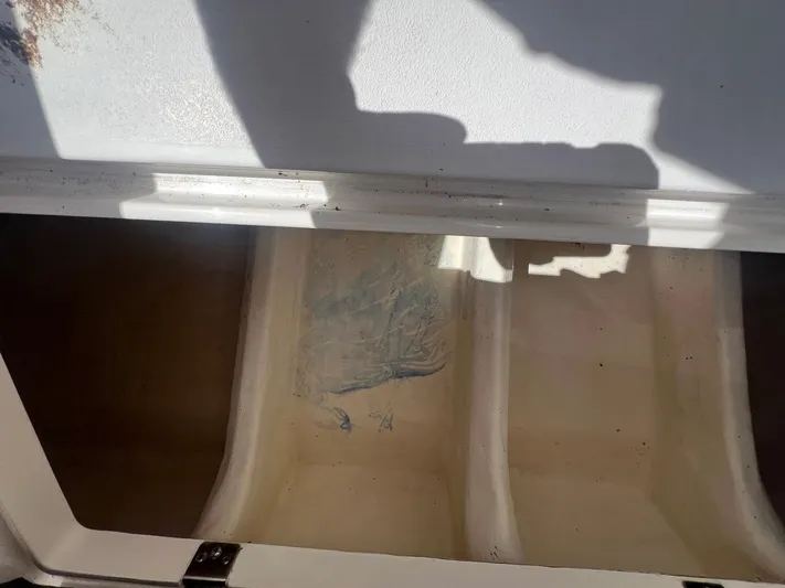  Yacht Photos Pics Open storage compartment on a 2017 Intrepid 327 Cuddy boat.