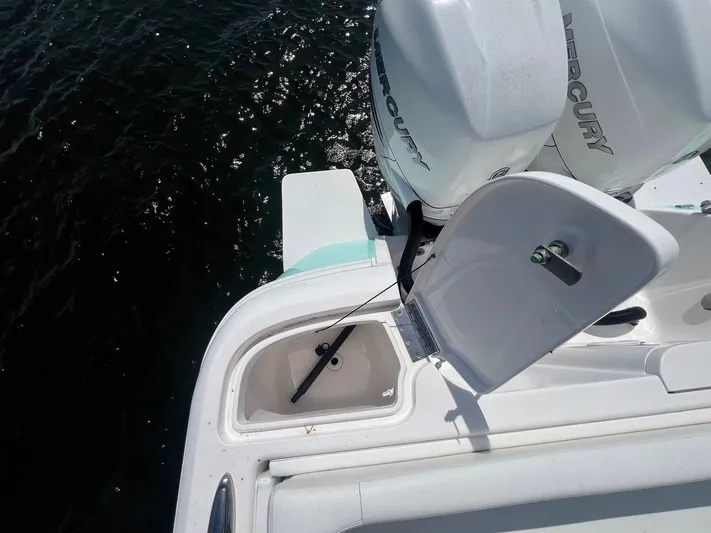  Yacht Photos Pics 2017 Intrepid 327 Cuddy boat with open storage compartment and Mercury engines.