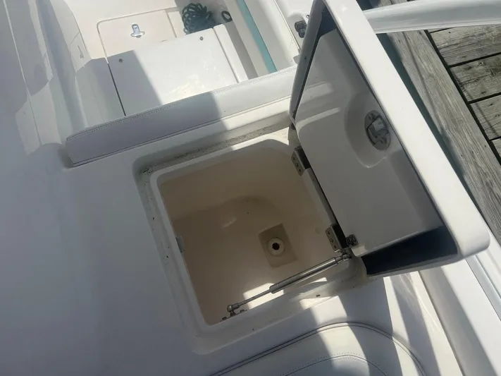  Yacht Photos Pics Open storage compartment on a 2017 Intrepid 327 Cuddy boat deck.