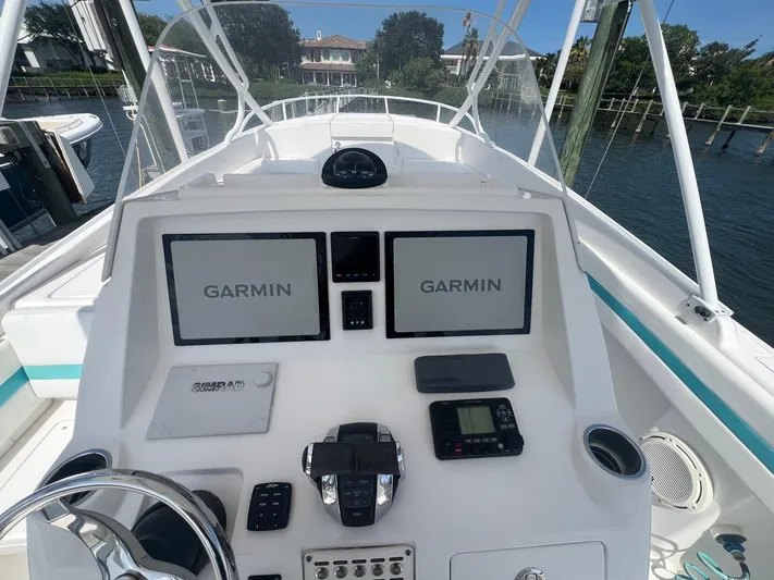  Yacht Photos Pics 2017 Intrepid 327 Cuddy boat dashboard with Garmin navigation displays.