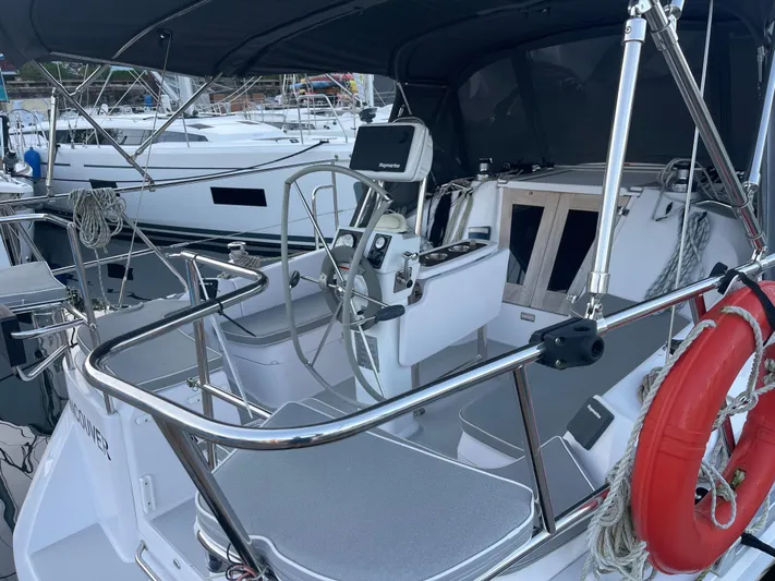 Nordlys Yacht Photos Pics 2018 Catalina 315 sailboat cockpit with steering wheel, navigation equipment, and safety gear.