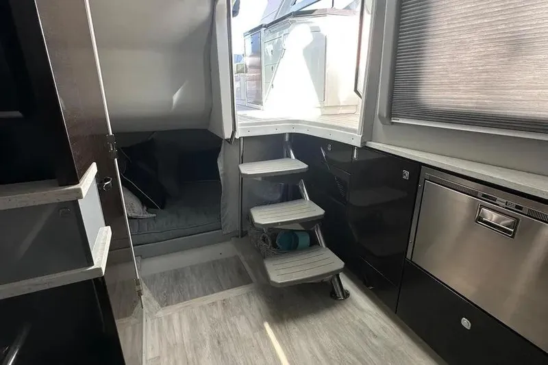  Yacht Photos Pics Interior of a 2019 Formula 430 Super Sport Crossover with modern kitchen and cozy seating area.