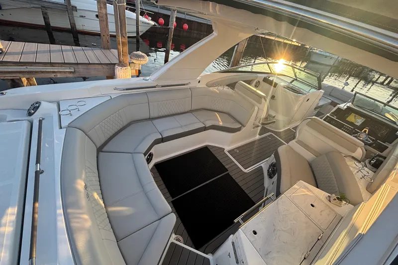  Yacht Photos Pics 2022 Searay SLX350 boat interior with luxurious seating and sunset view at the dock.