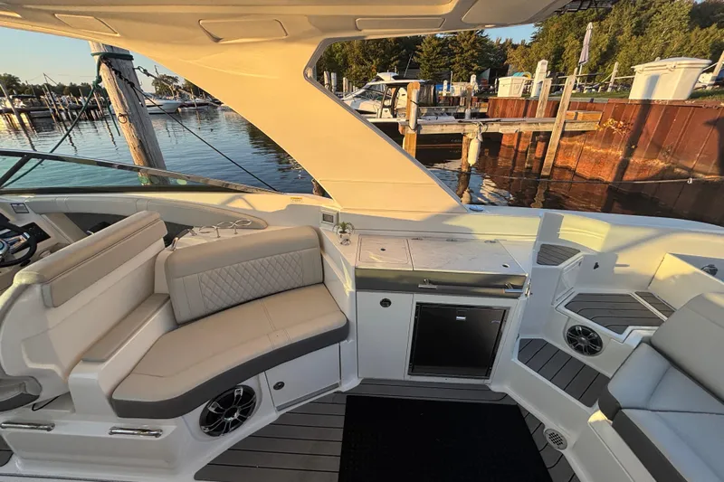  Yacht Photos Pics 2022 Searay SLX350 boat interior with seating and dock view.