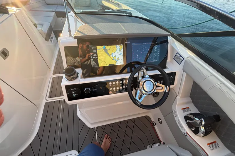  Yacht Photos Pics 2022 Searay SLX350 boat helm with modern navigation displays and sleek steering wheel.