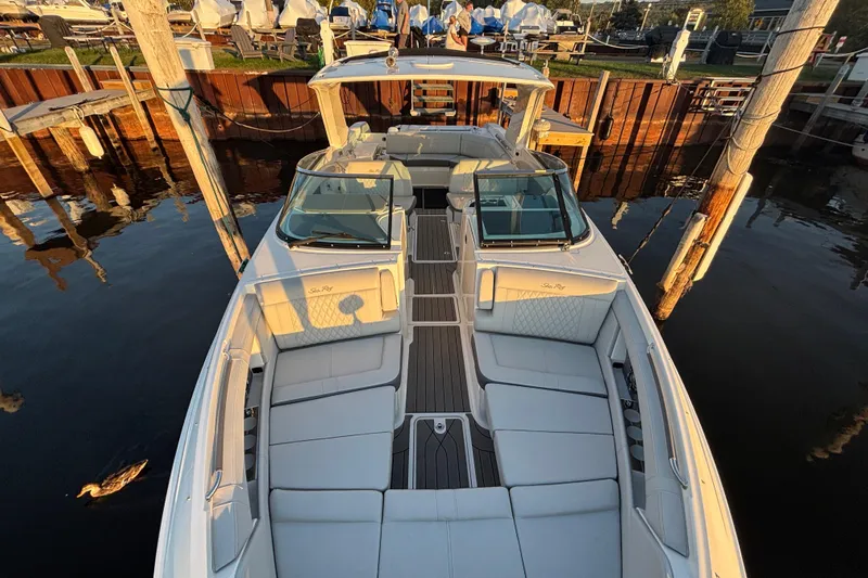  Yacht Photos Pics 2022 Searay SLX350 boat docked, featuring spacious seating and elegant design.