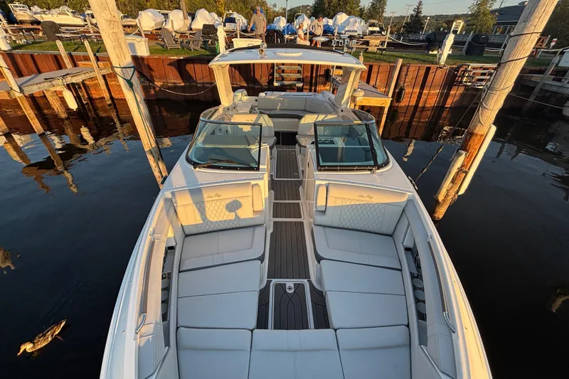  Yacht Photos Pics 2022 Searay SLX350 boat docked, featuring spacious seating and elegant design.