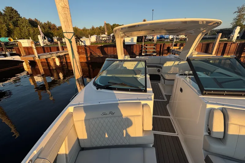  Yacht Photos Pics 2022 Searay SLX350 boat docked, featuring spacious seating and sleek design.