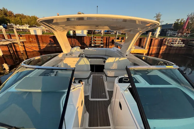  Yacht Photos Pics 2022 Searay SLX350 boat interior at dock, featuring spacious seating and modern design.