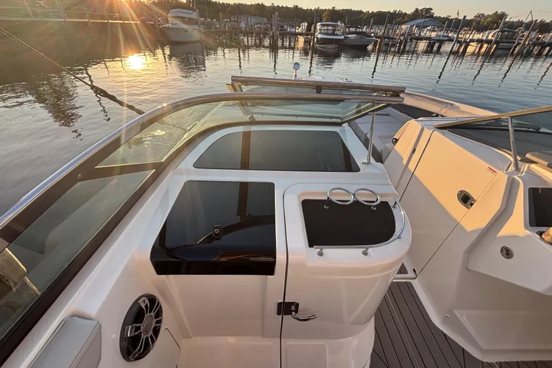  Yacht Photos Pics 2022 Searay SLX350 boat interior at sunset, docked in a marina.