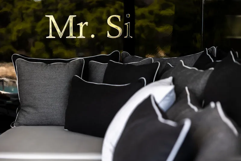 Mr. Si Yacht Photos Pics Luxurious cushions on Sunreef 60 Sail 2023 yacht, featuring "Mr. Si" text.
