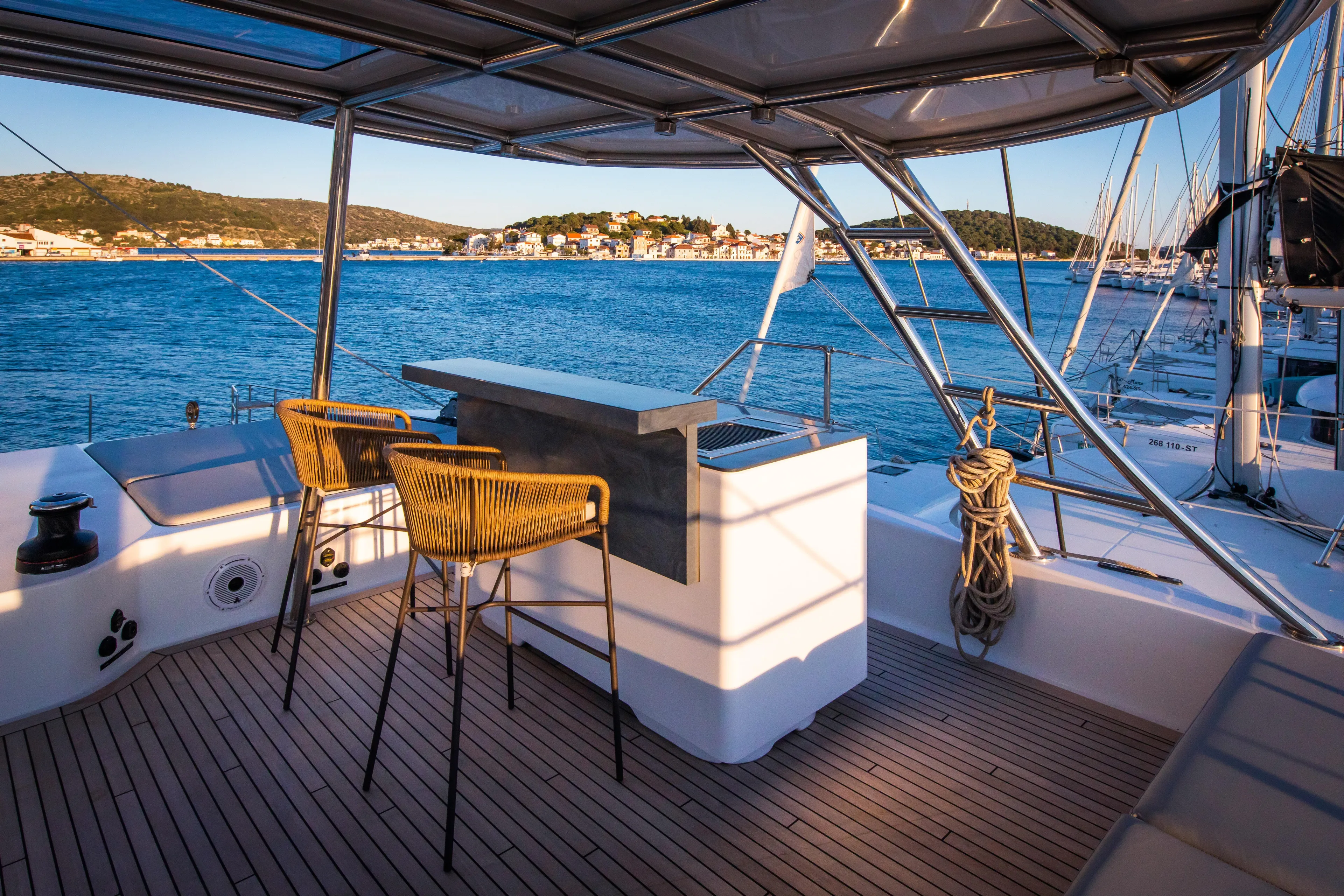 Mr. Si Yacht Photos Pics Luxurious Sunreef 60 Sail yacht deck with bar and ocean view, 2023 model.