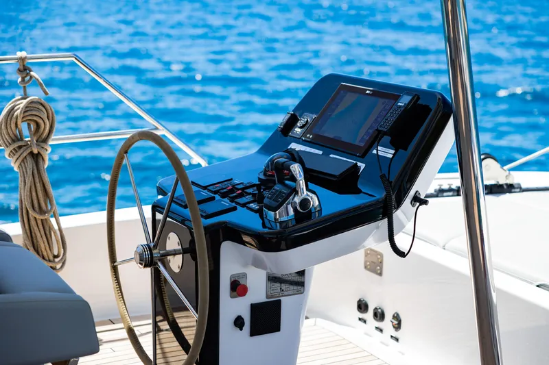 Mr. Si Yacht Photos Pics Helm of 2023 Sunreef 60 Sail yacht with navigation equipment and ocean view.