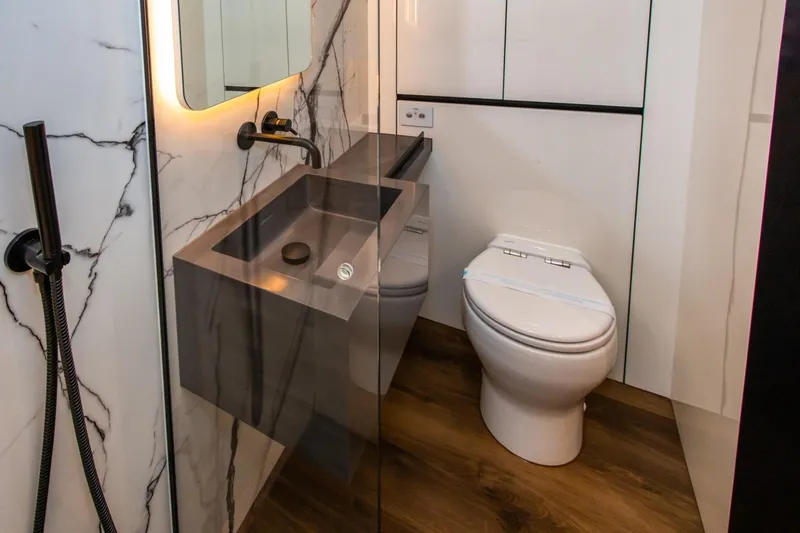 Mr. Si Yacht Photos Pics Luxurious bathroom in 2023 Sunreef 60 Sail yacht with modern fixtures and marble accents.