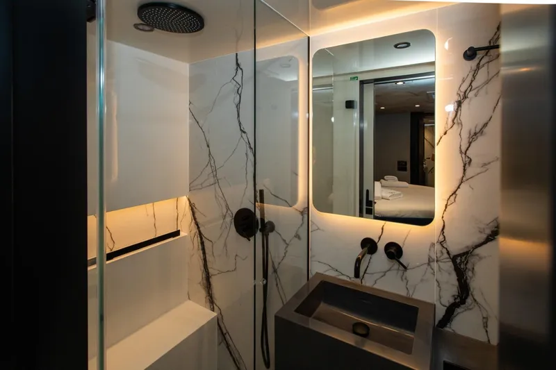 Mr. Si Yacht Photos Pics Luxurious bathroom in 2023 Sunreef 60 Sail yacht with modern fixtures and marble accents.