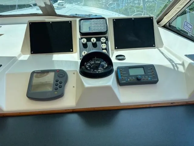 Thunderbolt Yacht Photos Pics 1988 Riviera Convertible boat dashboard with navigation instruments and controls.