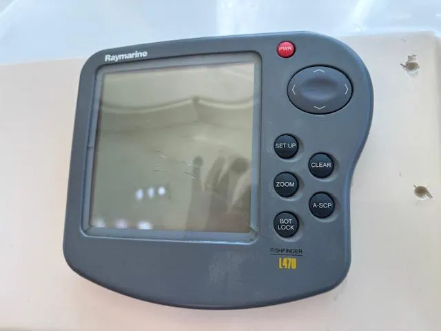 Thunderbolt Yacht Photos Pics Raymarine L470 fishfinder on 1988 Riviera Convertible boat dashboard.
