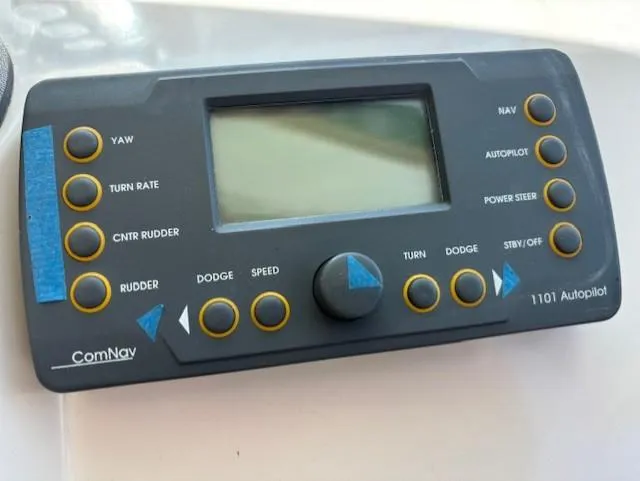 Thunderbolt Yacht Photos Pics ComNav 1101 Autopilot control panel with various navigation buttons and display screen.