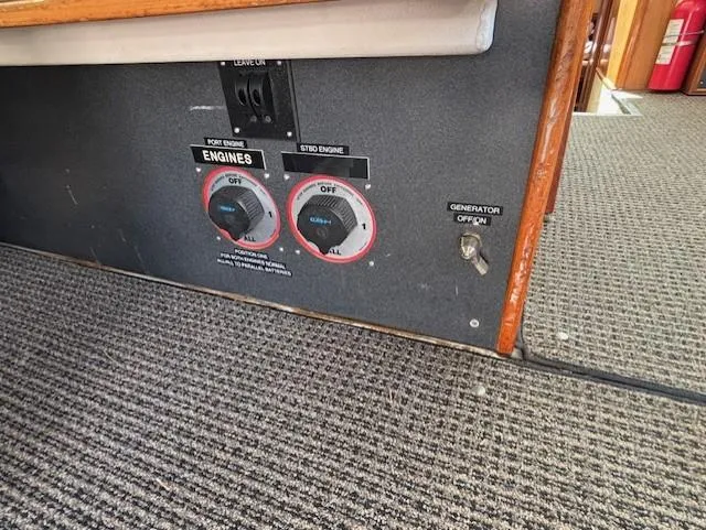 Thunderbolt Yacht Photos Pics Control panel of a 1988 Riviera Convertible boat with engine and generator switches.