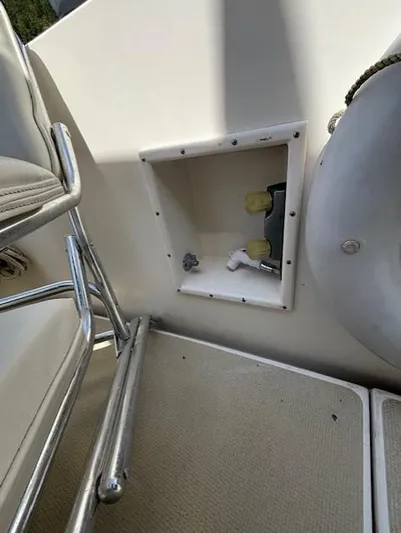 Thunderbolt Yacht Photos Pics 1988 Riviera Convertible boat interior with storage compartment and seating area.