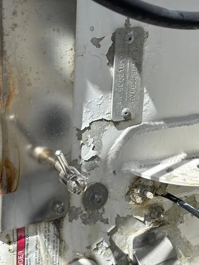 Thunderbolt Yacht Photos Pics 1988 Riviera Convertible metal plate with peeling paint and visible serial numbers.