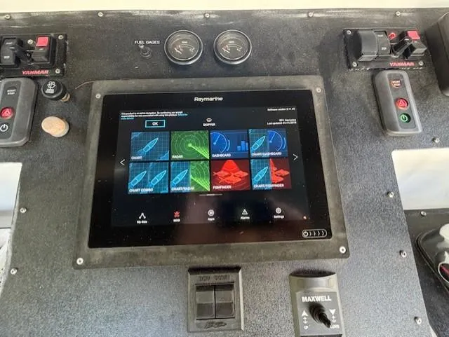 Thunderbolt Yacht Photos Pics 1988 Riviera Convertible dashboard with Raymarine navigation system and Yamaha controls.