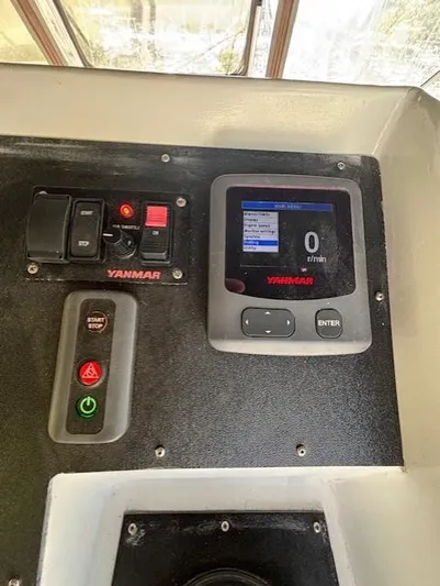 Thunderbolt Yacht Photos Pics Control panel of a 1988 Riviera Convertible boat with Yanmar display and switches.