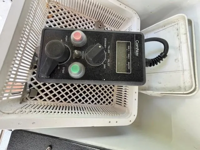 Thunderbolt Yacht Photos Pics Control panel in a 1988 Riviera Convertible boat, featuring buttons and dials in a white basket.