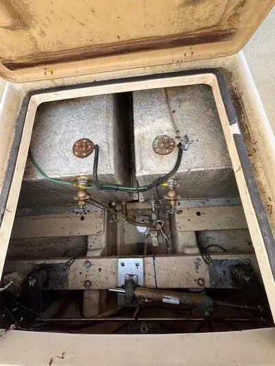 Thunderbolt Yacht Photos Pics 1988 Riviera Convertible engine compartment with visible fuel tanks and wiring.