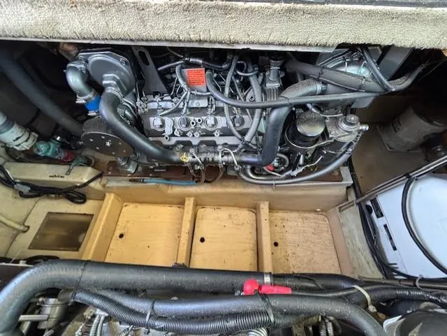 Thunderbolt Yacht Photos Pics Engine compartment of a 1988 Riviera Convertible, showcasing detailed mechanical components.