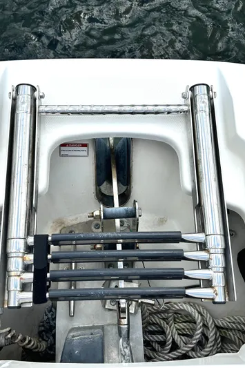  Yacht Photos Pics 2017 Boston Whaler 320 Vantage boat ladder and ropes by the water.